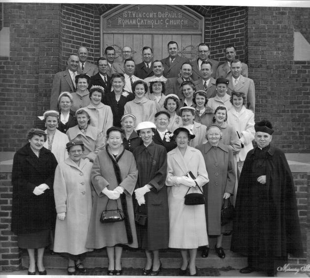 I am told this is a photo of parishioners that includes the church choir. 1956
