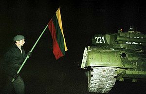 Lithuanian faces Soviet tank with a flag