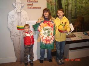Matejka family with Skullman flag, Skullman jersey and basketball