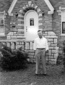 William, Jr. in front of the E. Cook St. family home built from the bricks and stones of the old White City Amusement Park