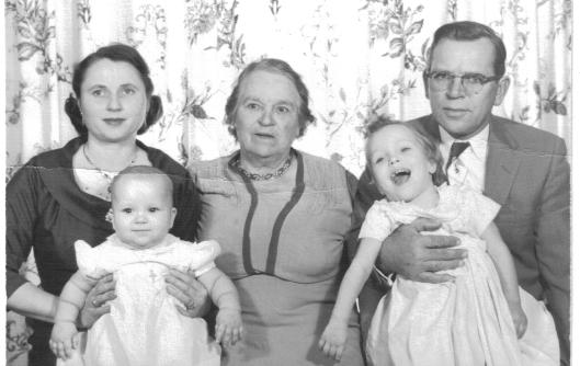 Irene Blazis holding daughter Barbara, William, Jr. holding Mary Agnes, and matriarch Mary (Chunis) Blazis (Stulzinski) in center. 1958